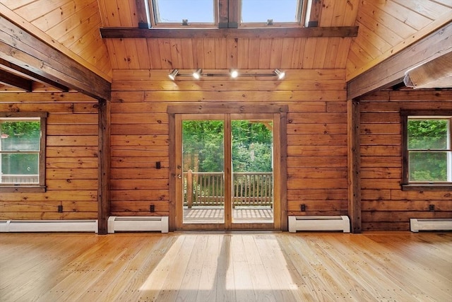 40 Lombard Rd, Hubbardston, MA 01452 - unfurnished room with baseboard heating, wood walls, beamed ceiling, and wood-type flooring