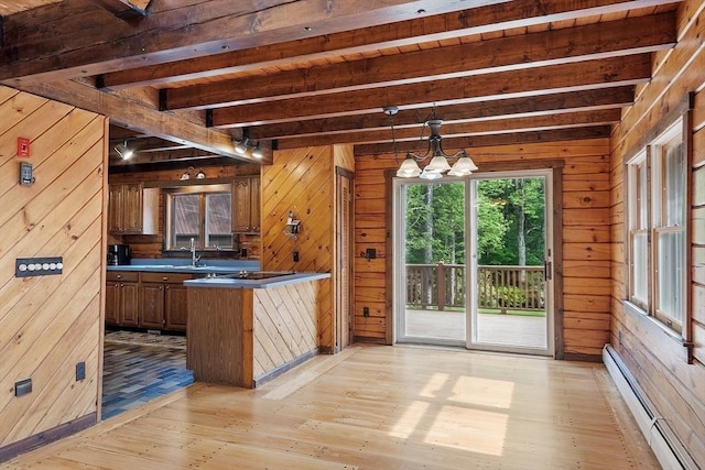 40 Lombard Rd, Hubbardston, MA 01452 - kitchen featuring a baseboard heating unit, beam ceiling, light wood-style floors, wood walls, and a chandelier