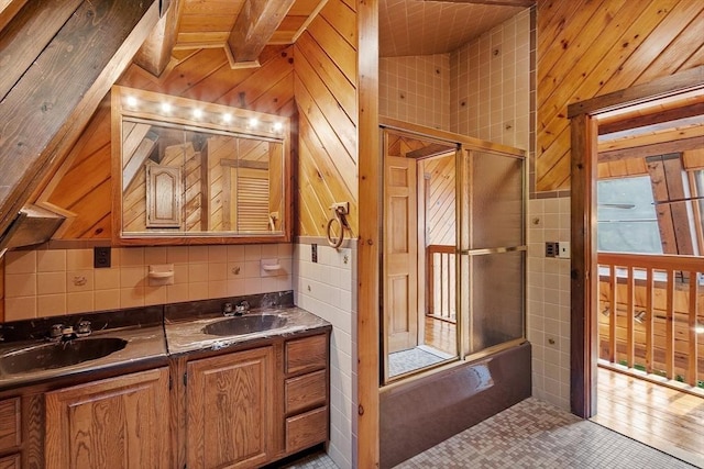 40 Lombard Rd, Hubbardston, MA 01452 - full bath with wood walls, double vanity, bath / shower combo with glass door, and tasteful backsplash