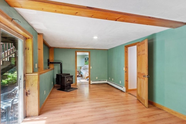 40 Lombard Rd, Hubbardston, MA 01452 - unfurnished living room with light wood-style floors, a wood stove, baseboard heating, recessed lighting, and baseboards