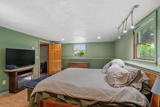 40 Lombard Rd, Hubbardston, MA 01452 - bedroom with wood finished floors, a fireplace, and baseboards