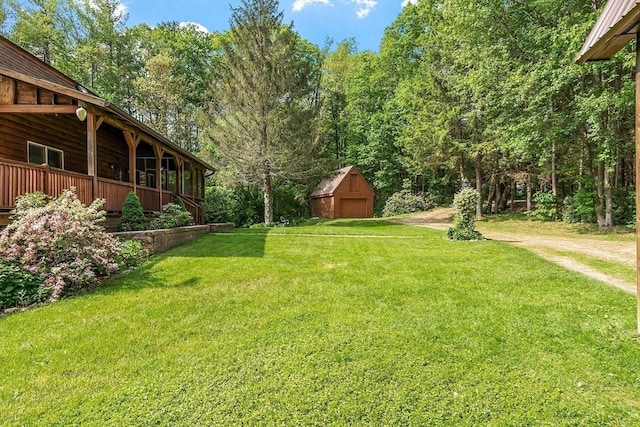 40 Lombard Rd, Hubbardston, MA 01452 - view of grassy yard featuring an outdoor structure and a view of trees