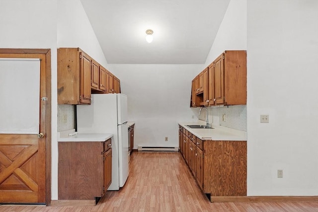 40 Lombard Rd, Hubbardston, MA 01452 - kitchen featuring a baseboard radiator, a sink, lofted ceiling, freestanding refrigerator, and light countertops