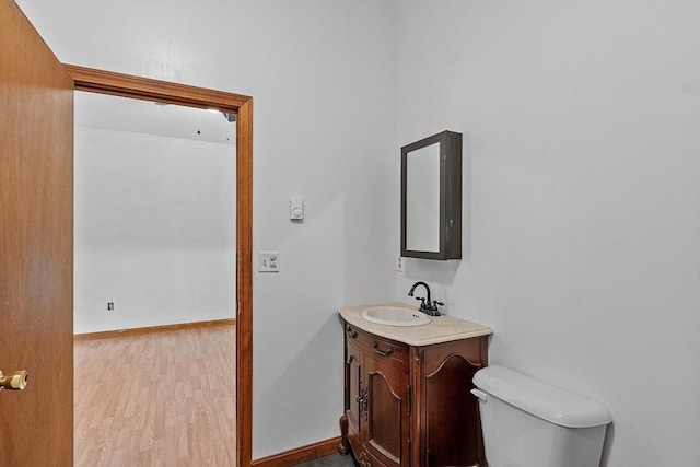 40 Lombard Rd, Hubbardston, MA 01452 - bathroom featuring vanity, toilet, and wood finished floors