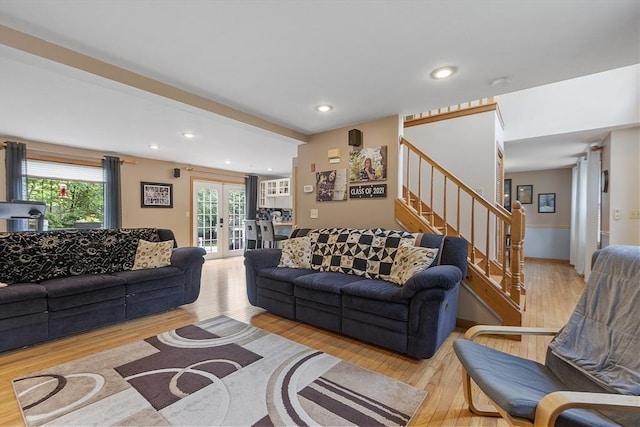 51 Carrie Ann Ln, Fitchburg, MA 01420 - living room with french doors, wood finished floors, stairway, and recessed lighting