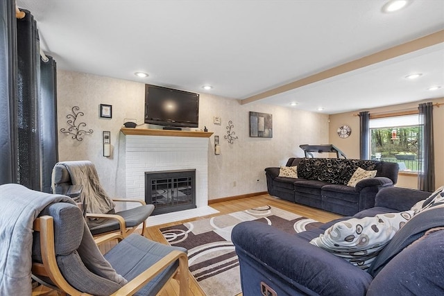 51 Carrie Ann Ln, Fitchburg, MA 01420 - living room with wood finished floors, a brick fireplace, and recessed lighting
