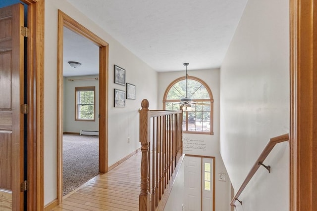 51 Carrie Ann Ln, Fitchburg, MA 01420 - hall with an upstairs landing, baseboard heating, and light wood-type flooring
