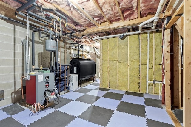 51 Carrie Ann Ln, Fitchburg, MA 01420 - unfinished below grade area featuring oil tank, tile patterned floors, and a heating unit