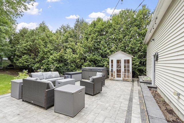 51 Carrie Ann Ln, Fitchburg, MA 01420 - view of patio featuring a hot tub, an outdoor hangout area, and a storage shed