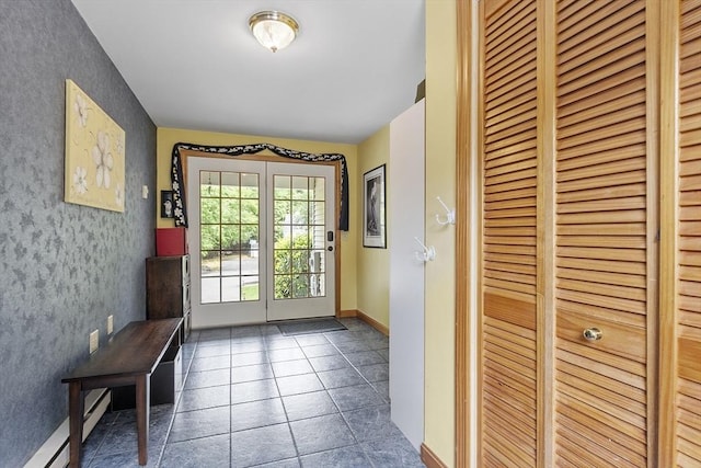 51 Carrie Ann Ln, Fitchburg, MA 01420 - entryway featuring wallpapered walls, baseboard heating, and tile patterned flooring