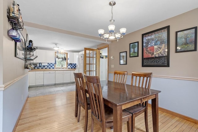 51 Carrie Ann Ln, Fitchburg, MA 01420 - dining space featuring a chandelier and light wood finished floors