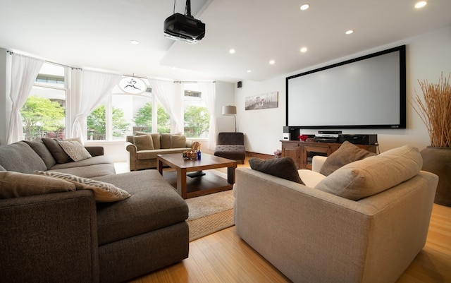 cinema room with light wood-type flooring