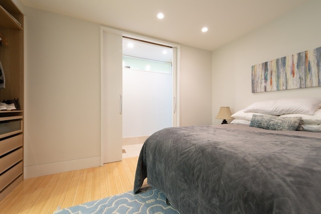 bedroom with light hardwood / wood-style floors