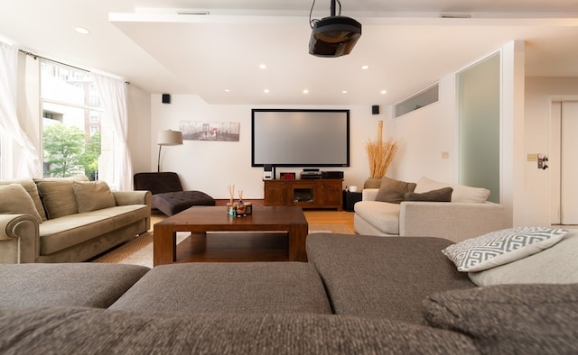 home theater room featuring light hardwood / wood-style floors