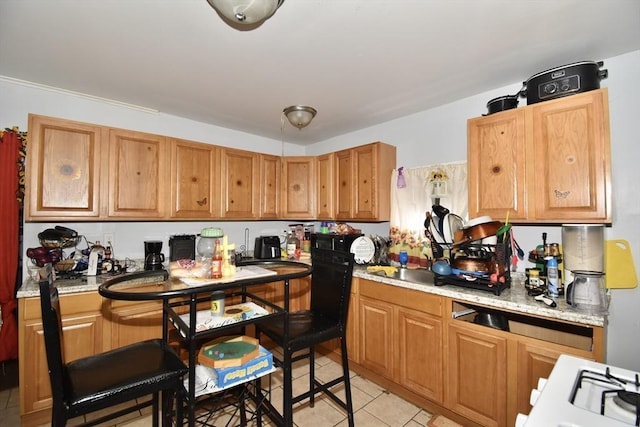 kitchen featuring light tile patterned flooring