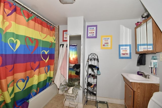 bathroom with vanity, tile patterned flooring, shower / bath combination with curtain, and baseboards