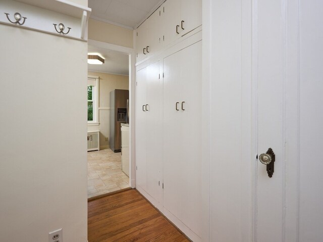 hall featuring light tile patterned flooring