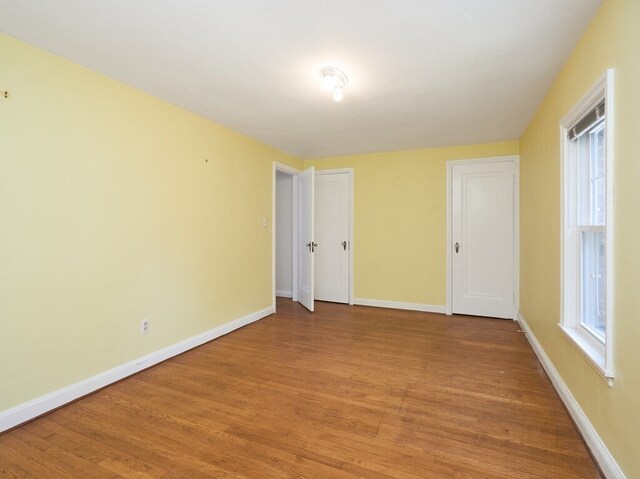 unfurnished room featuring hardwood / wood-style floors