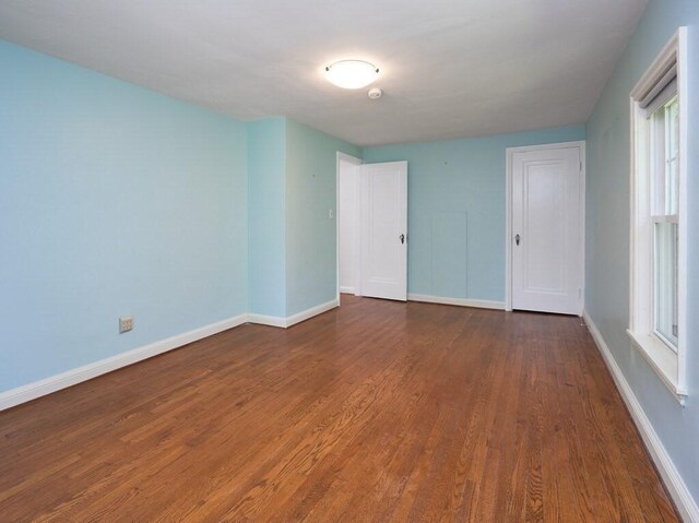 empty room featuring wood-type flooring