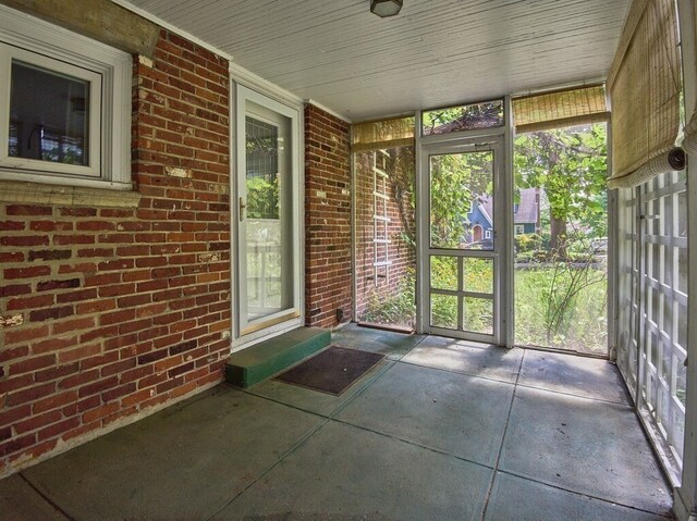 unfurnished sunroom featuring plenty of natural light