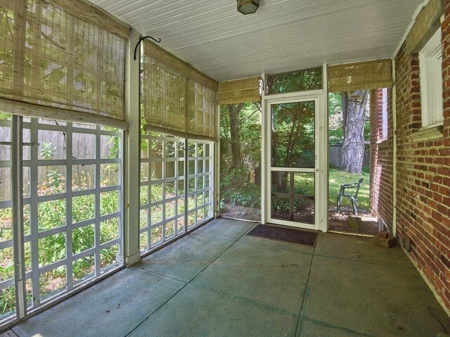 unfurnished sunroom with plenty of natural light