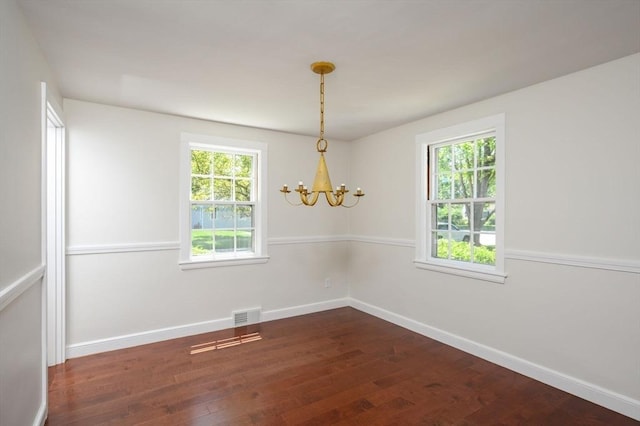 30 Huntley Rd, Hingham, MA 02043 - empty room with a chandelier, healthy amount of natural light, and dark wood-style floors
