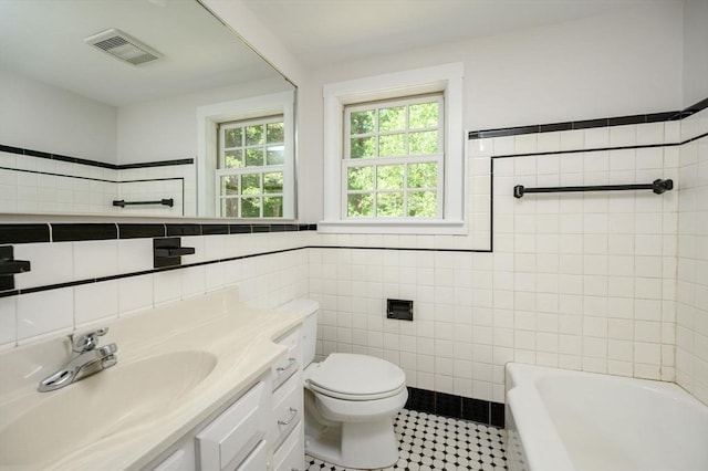 30 Huntley Rd, Hingham, MA 02043 - full bathroom featuring tile walls, vanity, a tub to relax in, tile patterned flooring, and a shower