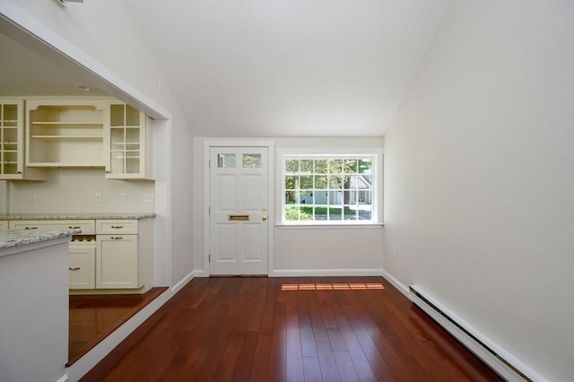 30 Huntley Rd, Hingham, MA 02043 - kitchen featuring a baseboard radiator, dark wood finished floors, light stone countertops, lofted ceiling, and glass insert cabinets