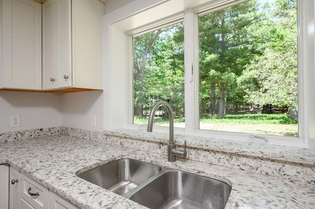 30 Huntley Rd, Hingham, MA 02043 - kitchen with white cabinetry and light stone countertops