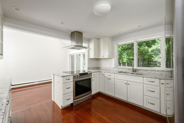 30 Huntley Rd, Hingham, MA 02043 - kitchen featuring exhaust hood, stainless steel range with electric stovetop, a baseboard heating unit, dark wood-style flooring, and a peninsula