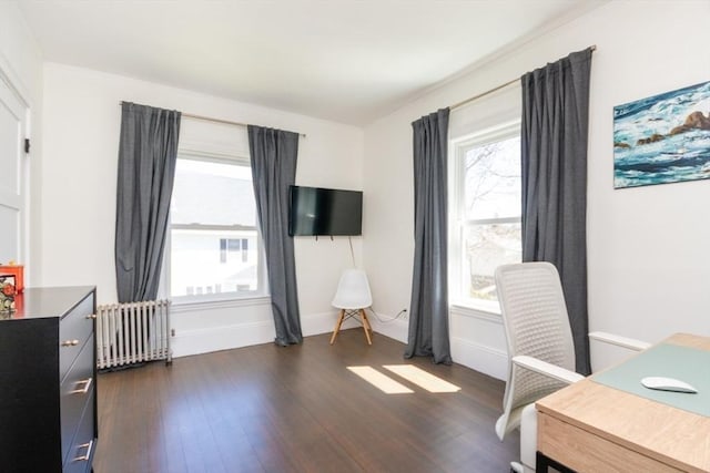 home office with baseboards, radiator heating unit, and dark wood-style floors