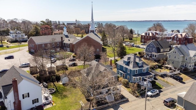 drone / aerial view featuring a residential view and a water view