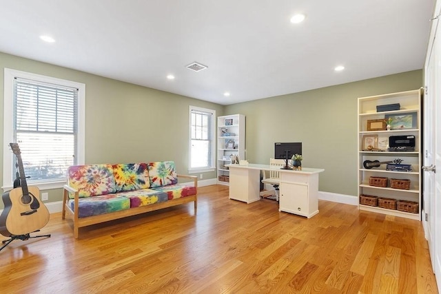 home office featuring recessed lighting, visible vents, plenty of natural light, and light wood finished floors