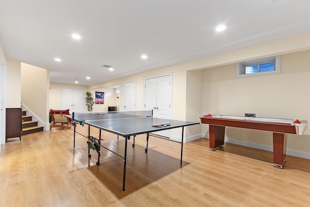 game room with baseboards, light wood-type flooring, and recessed lighting