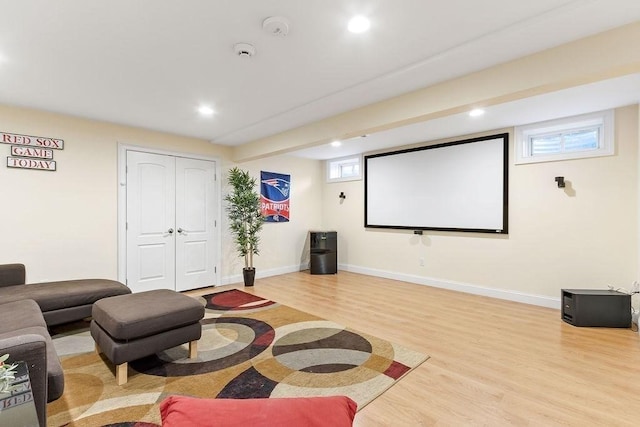 cinema featuring light wood-type flooring, baseboards, and recessed lighting