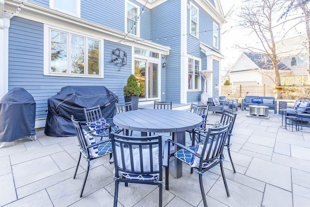 view of patio / terrace with an outdoor hangout area, outdoor dining space, grilling area, and fence