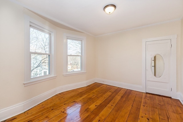 unfurnished room featuring wood-type flooring and a wealth of natural light