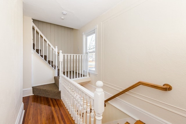 staircase with dark hardwood / wood-style floors