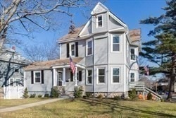 view of property featuring a front lawn