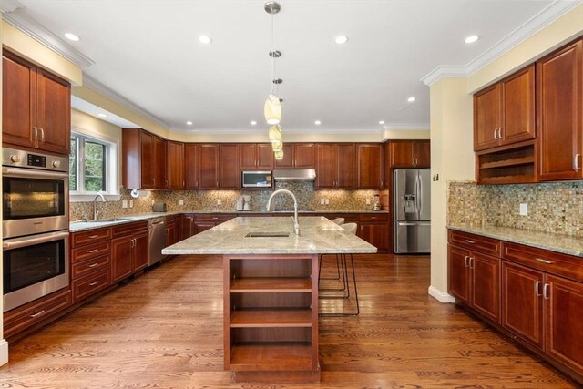 kitchen with wood finished floors, a sink, appliances with stainless steel finishes, open shelves, and crown molding