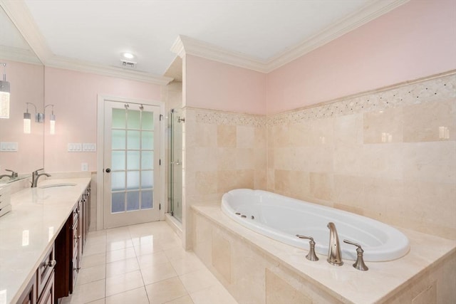 full bath featuring a garden tub, ornamental molding, a stall shower, a sink, and tile patterned floors