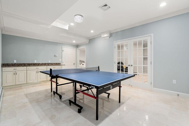 game room featuring light tile patterned flooring, ornamental molding, and french doors