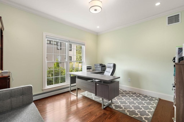 office space with wood finished floors, visible vents, baseboards, ornamental molding, and baseboard heating