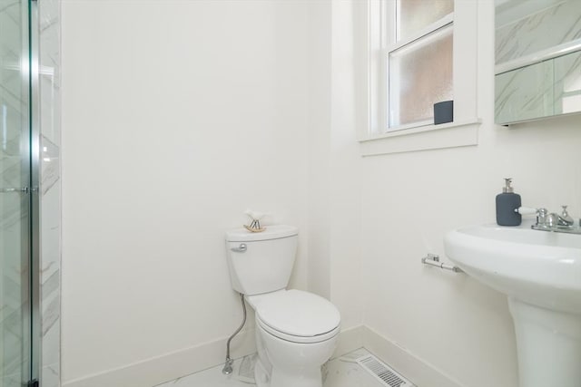 152 Pleasant St, Boston, MA 02125 - full bath with a marble finish shower and marble look tiles