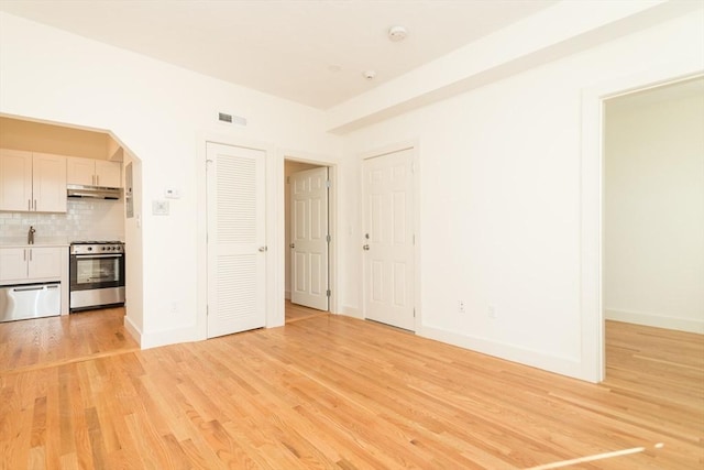 152 Pleasant St, Boston, MA 02125 - unfurnished living room featuring light wood-style flooring and baseboards