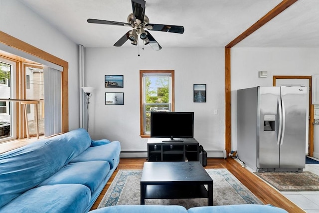 339-341 Norfolk St, Cambridge, MA 02139 - living area with a baseboard radiator, a ceiling fan, and wood finished floors