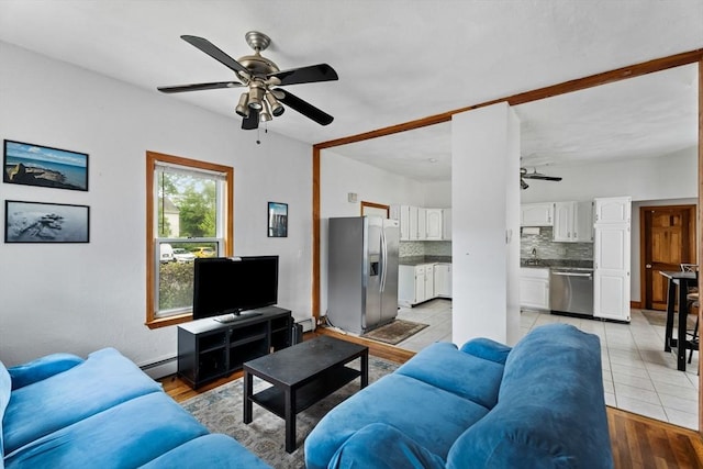 339-341 Norfolk St, Cambridge, MA 02139 - living room featuring a ceiling fan, baseboard heating, a baseboard heating unit, and light wood-style floors
