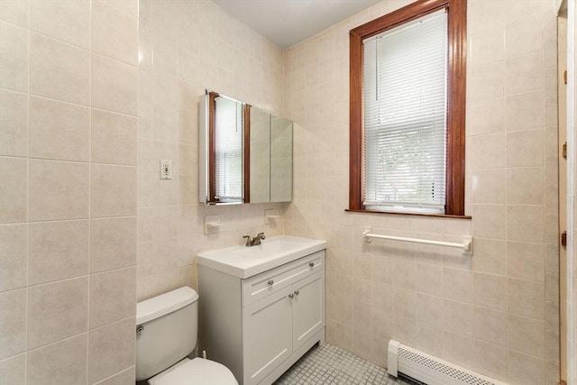 339-341 Norfolk St, Cambridge, MA 02139 - bathroom featuring a baseboard radiator, toilet, vanity, tile walls, and plenty of natural light