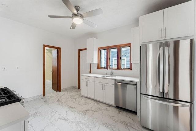 339-341 Norfolk St, Cambridge, MA 02139 - kitchen featuring appliances with stainless steel finishes, a sink, light countertops, and white cabinets
