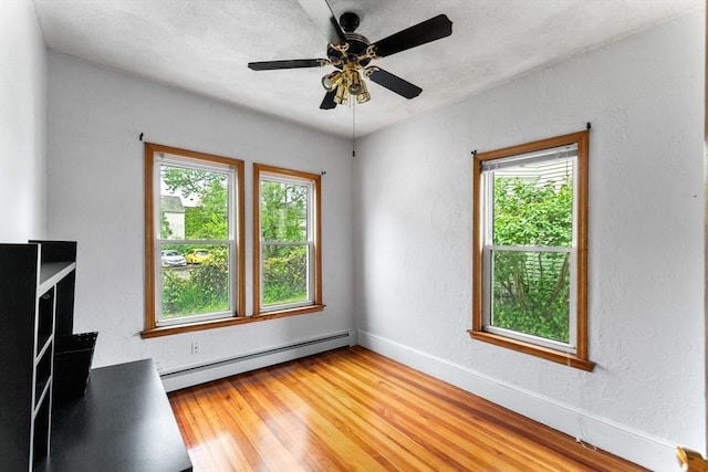 339-341 Norfolk St, Cambridge, MA 02139 - unfurnished room with a baseboard radiator, light wood-type flooring, baseboards, and a ceiling fan